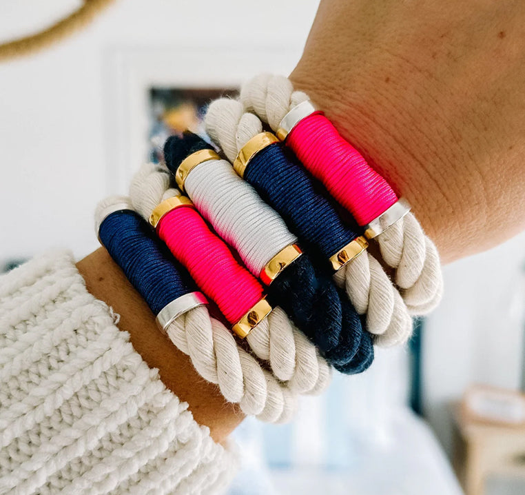 Stack of Allison Cole Hanover bracelets on woman's wrist