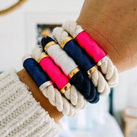 Stack of Allison Cole Hanover bracelets on woman's wrist