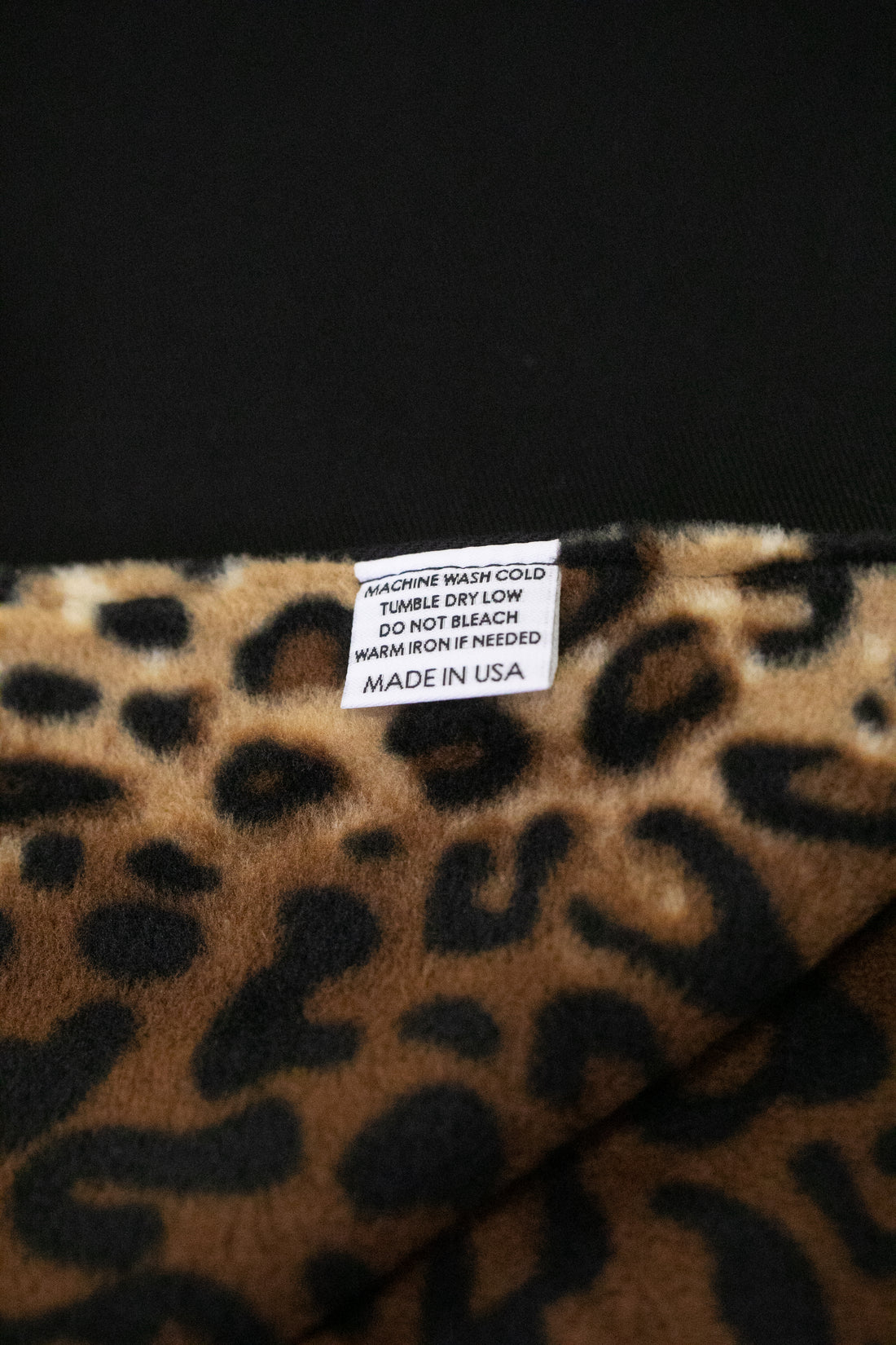 Made in America Denim Blanket Company black denim blanket with leopard print fleece lining