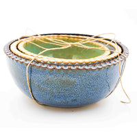 Trio of small nested stoneware bowls with blue, light blue, and green glaze handmade by Allison Morrissey