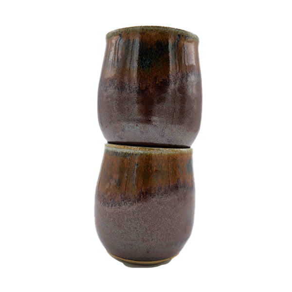 Side photo of stacked pair of stoneware wine mugs with brown glaze handmade by Allison Morrissey