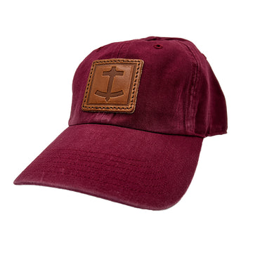 DBC Cardinal red baseball hat with brown leather patch embossed with Denim Blanket Company anchor logo