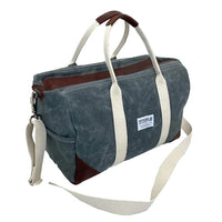 Side view of Steele Canvas slate colored canvas duffle gym travel bag with brown leather accents