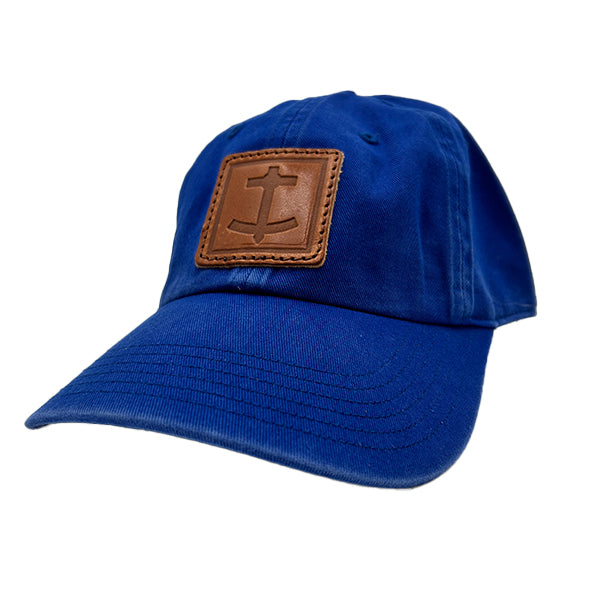 DBC royal blue baseball hat with brown leather patch embossed with Denim Blanket Company anchor logo