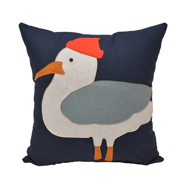 Large navy blue square throw pillow with a seagull wearing a red cap