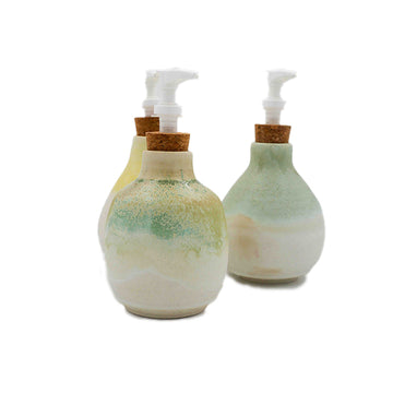 Trio of stoneware soap or lotion dispensers with green and cream glaze handmade by Allison Morrissey