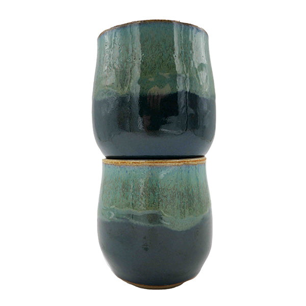 Side photo of stacked pair of stoneware wine mugs with teal glaze handmade by Allison Morrissey