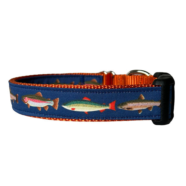 Sew Fetch Dog Co. navy dog collar with orange trim designed with trout print and black plastic closure