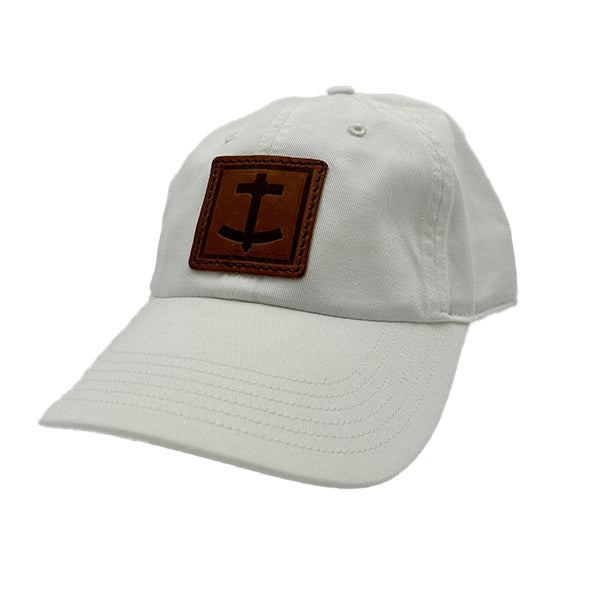 DBC white baseball hat with brown leather patch embossed with Denim Blanket Company anchor logo