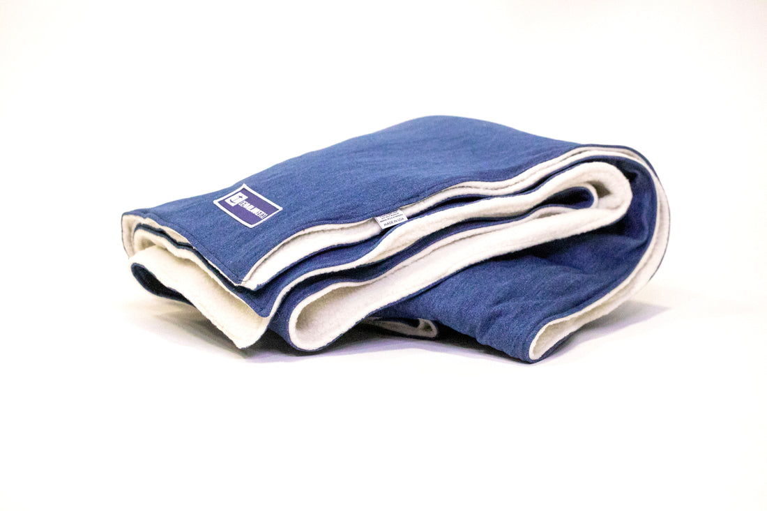 Side view Denim Blanket Company classic Jean Denim Blanket with cream fleece lining