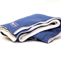 Side view Denim Blanket Company classic Jean Denim Blanket with cream fleece lining