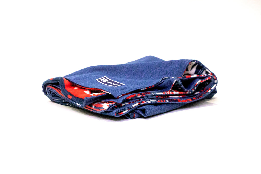 Side view of Denim Blanket Company classic jean denim blanket with southwestern print fleece lining