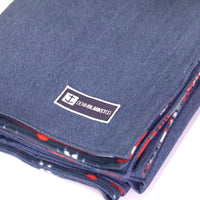 Logo shot of Denim Blanket Company classic jean denim blanket with southwestern print fleece lining