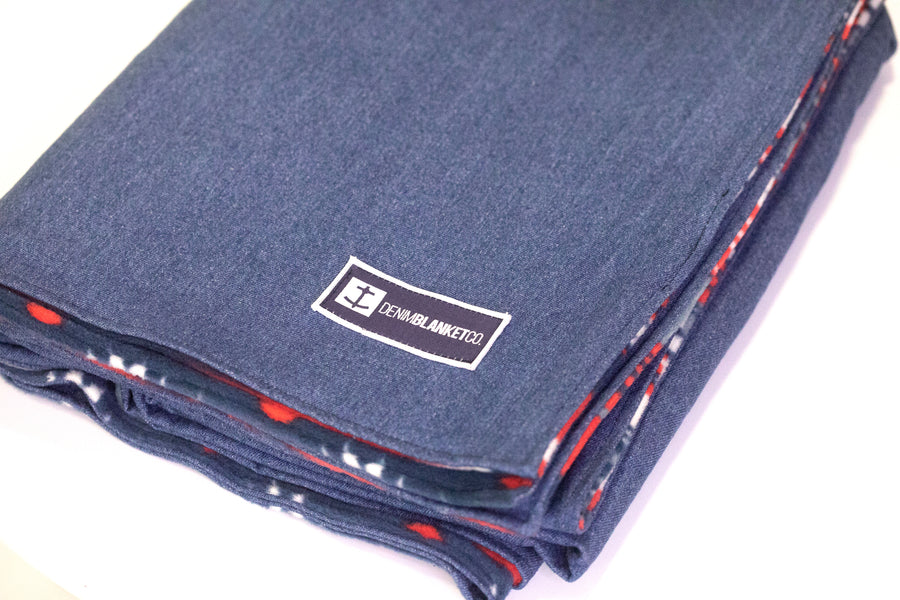 Logo shot of Denim Blanket Company classic jean denim blanket with southwestern print fleece lining