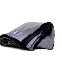 Side view of Denim Blanket Company rail car denim blanket with navy fleece lining